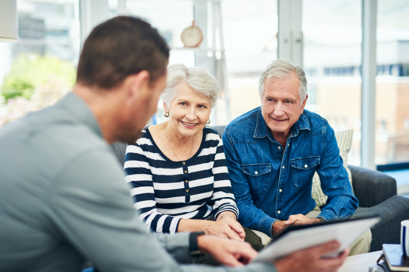 senior couple having a consultation with a financial advisor at home.