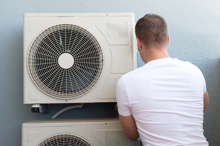 Male technician installing air-conditioning system, Why Do I Need AC Maintenance Now? | Link Service Heating & Cooling